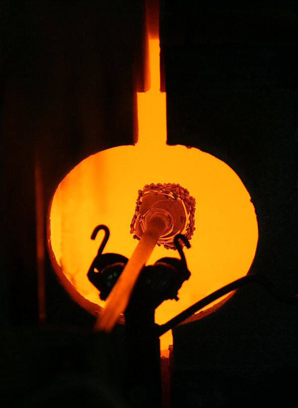 melting the colored glass in the Glory Hole furnace