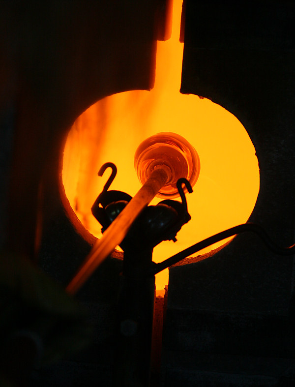 melting the colored glass in the Glory Hole furnace